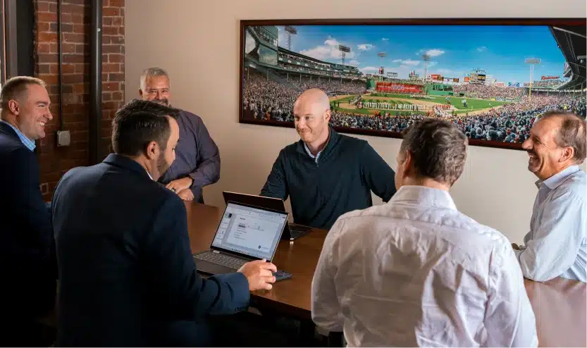 Business professionals engaged in a lively discussion during an informal office meeting session