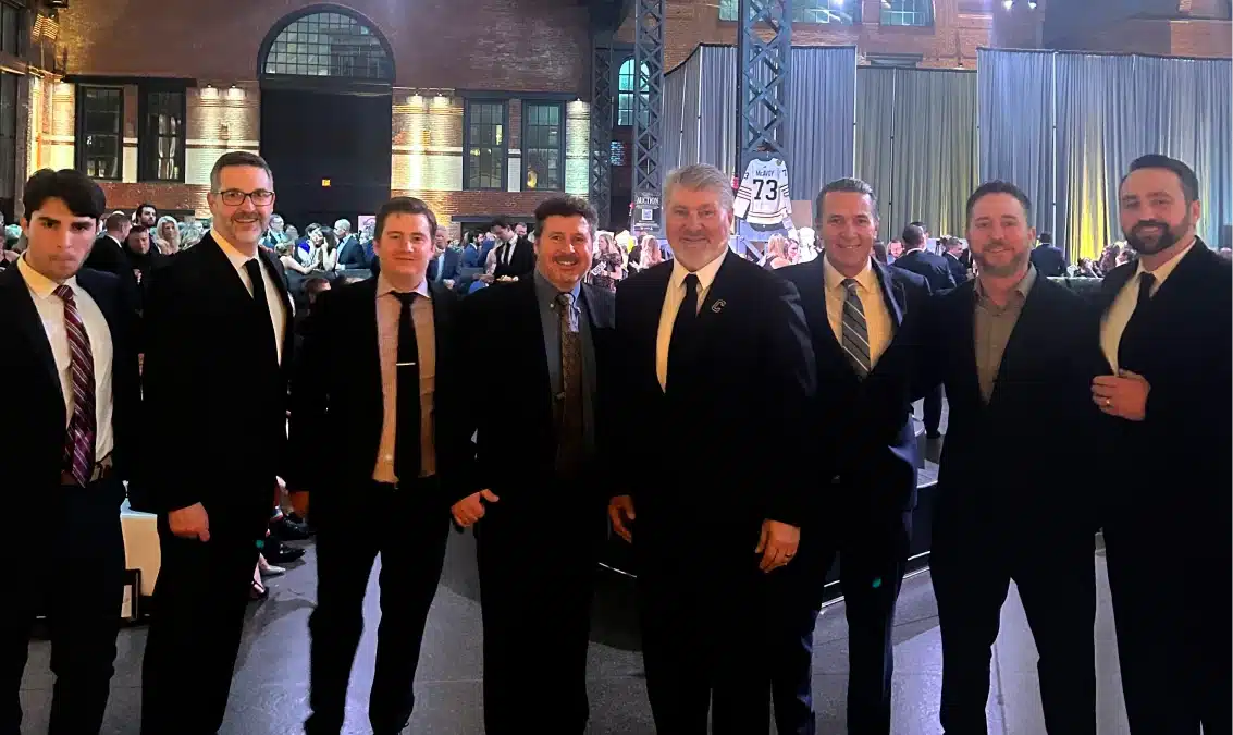 DataPivot team attending Bourque Family Foundation event inside an industrial-style brick venue