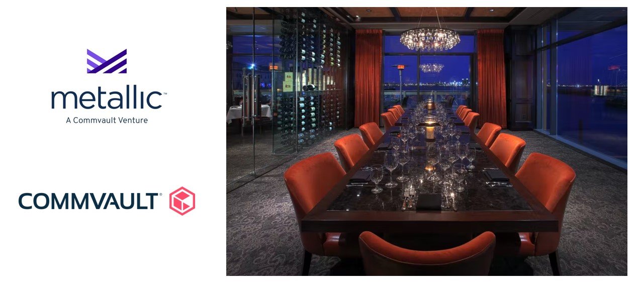 Elegant dining room setup with formal place settings and panoramic waterfront views at night