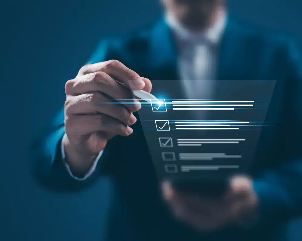 Business professional using a stylus to check tasks on a futuristic digital checklist interface